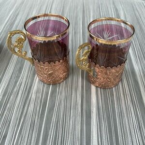 Colored glass cups and saucers